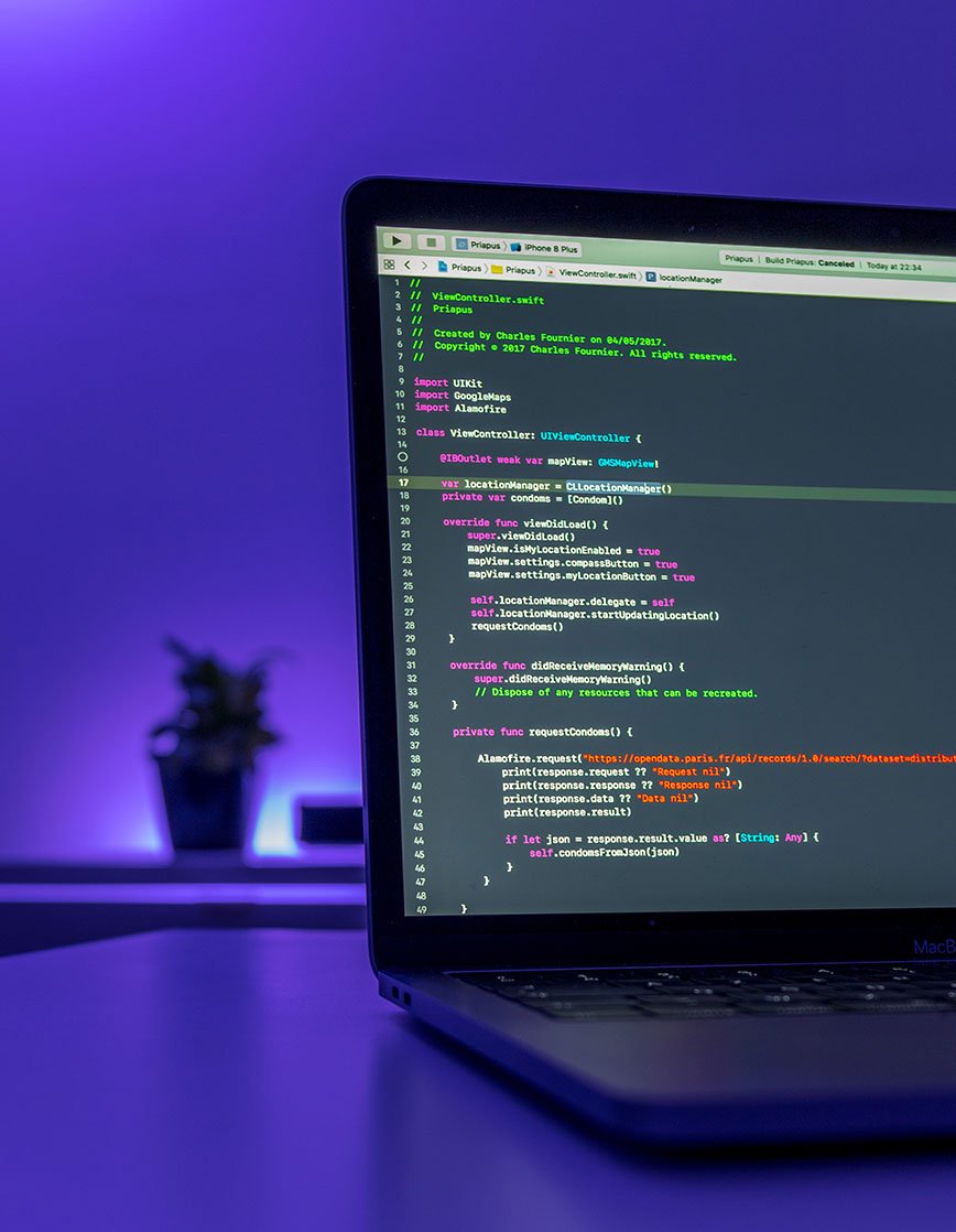 Laptop with Coding on Screen Laptop with Coding on Screen